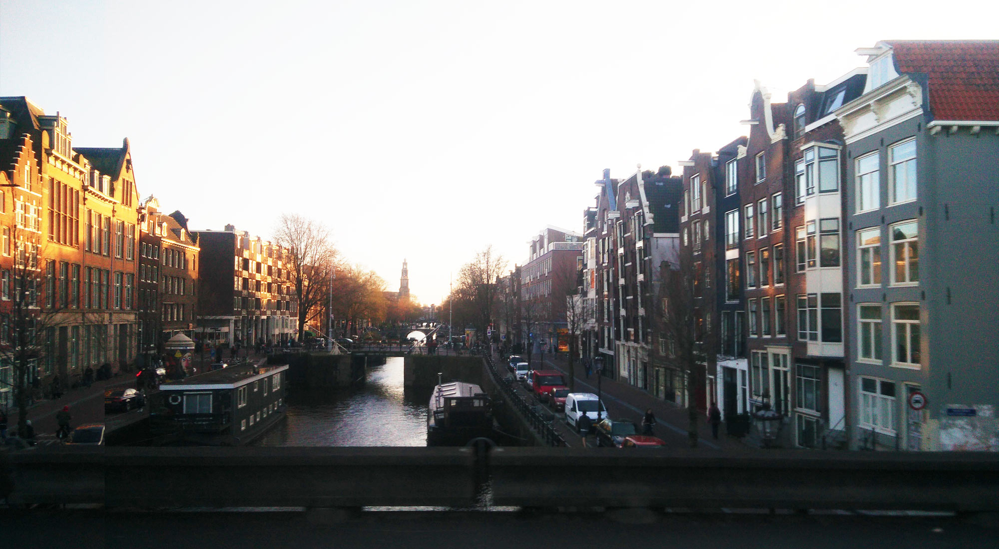 a canal in Amsterdam at sunset